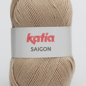 May include: A ball of beige yarn with the Katia brand label and the text "SAIGON" on it.
