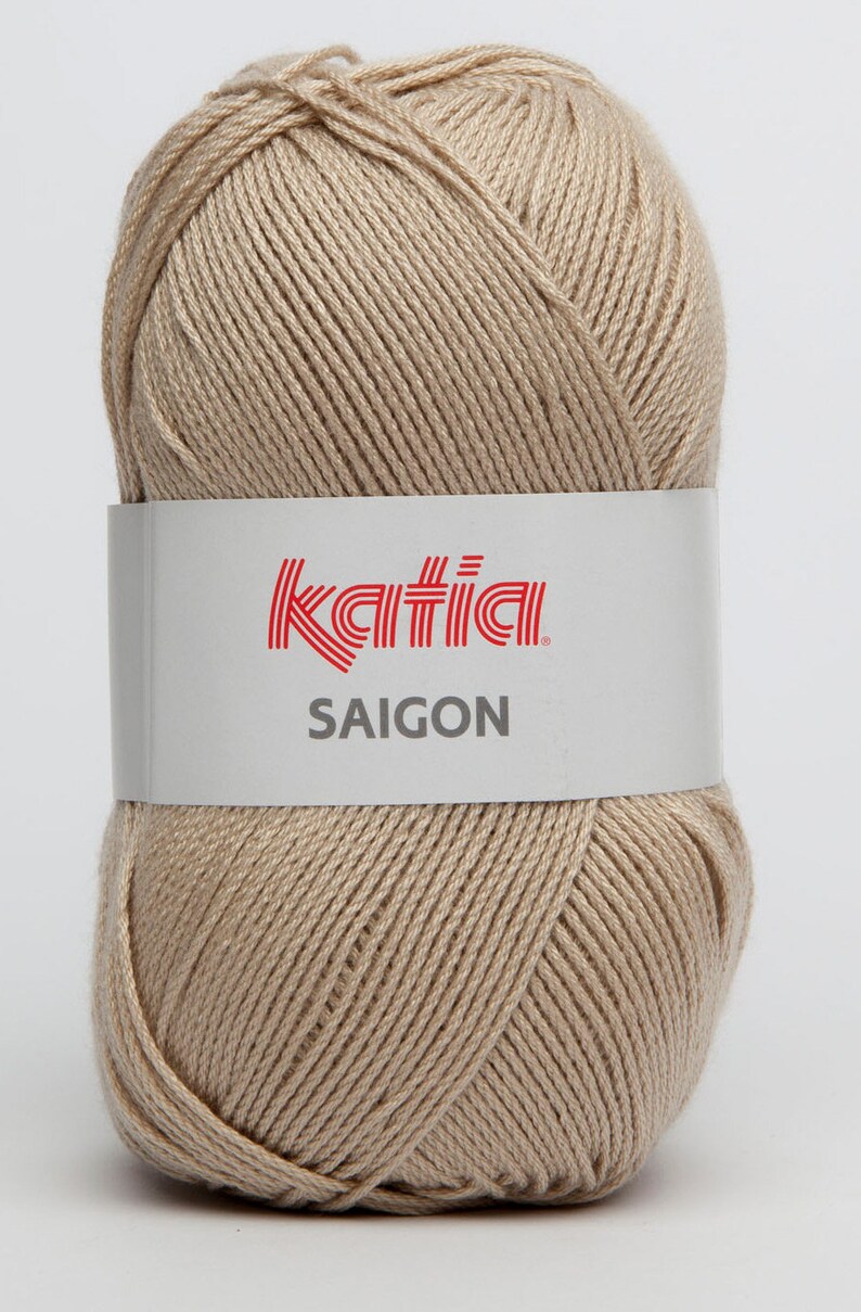 May include: A ball of beige yarn with the Katia brand label and the text "SAIGON" on it.