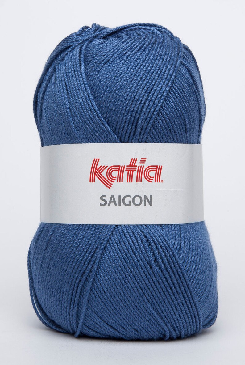 May include: A ball of Katia Saigon yarn in a blue shade. The label reads "Katia Saigon".
