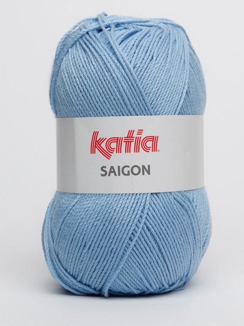 May include: A ball of light blue Katia Saigon yarn. The yarn is 100% cotton and is suitable for knitting and crocheting.