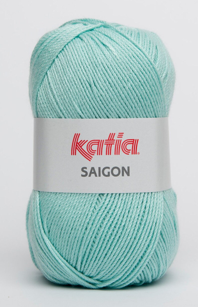May include: A ball of light blue yarn with a white label that says "Katia SAIGON".
