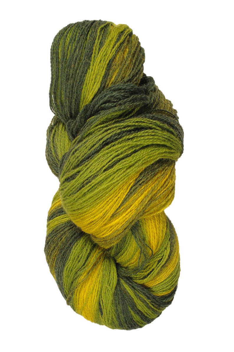 May include: A skein of yarn in shades of green and yellow. The yarn is twisted and knotted, showing the different colors.