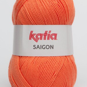 May include: A ball of Katia Saigon yarn in a bright orange color. The yarn is made of 100% cotton and is perfect for crocheting or knitting.