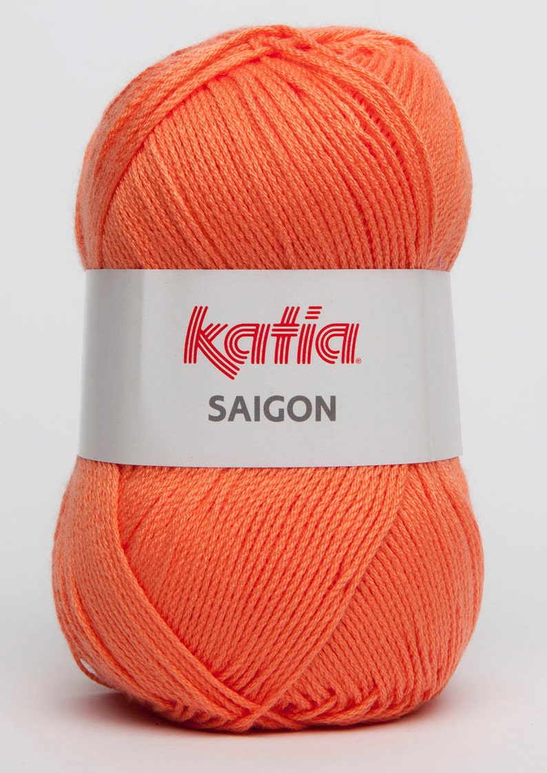 May include: A ball of Katia Saigon yarn in a bright orange color. The yarn is made of 100% cotton and is perfect for crocheting or knitting.
