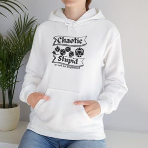 May include: White hooded sweatshirt with a front pocket. The black text on the front reads "Chaotic Stupid is not an alignment" with dice graphics. The sweatshirt is a casual garment.