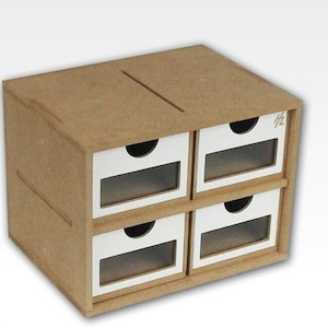 May include: A small, four-drawer wooden storage box. The box is made of light brown wood with white drawer fronts and clear plastic windows. A slot is cut into the top of the box. The drawers have small, curved handles.