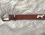 brown belt with buffalo and wolves