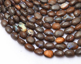 May include: A strand of brown, oval-shaped opal beads. The beads have a dark brown base with flashes of blue, green, and red.