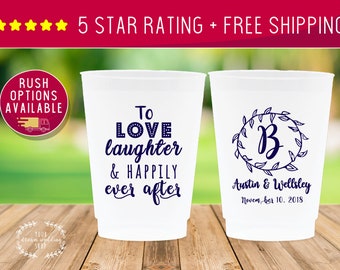 May include: Two white plastic cups with blue text. One cup says "To love laughter & happily ever after". The other cup has a wreath with the letter "B" inside and says "Austin & Wellsley November 10, 2018".