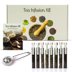 May include: A tea infusion kit with a box labeled "Tea Infusion Kit." The kit includes a variety of teas in glass tubes, a tea infuser, and a booklet. Teas include Lavender, Vanilla Chai, Lemon Honey, and more. A mortar and pestle are also included.