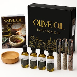 May include: An olive oil infusion kit with a black box and gold lettering that reads "Olive Oil Infusion Kit". The kit includes small bottles of flavored olive oils, glass tubes of herbs, and a wooden bowl. A booklet is also included.