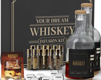 May include: A black box with the text "Your Dream Whiskey Infusion Kit" on the front. The box contains two clear glass bottles with cork tops, 16 small glass vials with various spices and herbs, and six silver ice cubes.