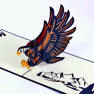 Carte pop-up 3D faite main avec icônes cadeau aigle
