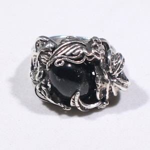 One of a kind  hand made Sterling Silver solitaire ring with Obsidian stone, set in a floral design.