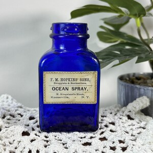 Antik koboltblå F. M. Hopkins' Sons Ocean Spray apoteksflaska Keeseville