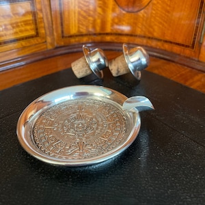 Mexican sterling silver ashtray and two cork stoppers with silver-plated alpaca hat