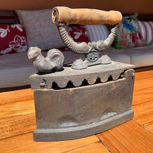Vintage cast iron iron, old model with carbon tank