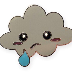 May include: A grey cloud with a sad face and a single blue teardrop. The cloud has black eyes, a pink blush, and a frowning mouth.