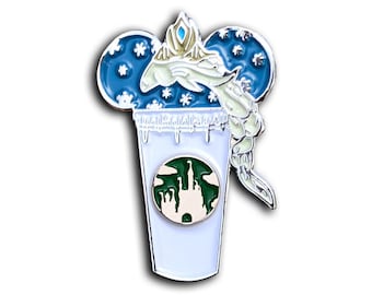 May include: Enamel pin featuring a stylized design of a coffee cup with a Disney castle logo. The cup is topped with a blue and white design of a character's hair and a crown. The pin has a silver outline and a white background.