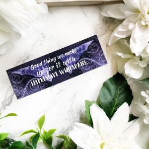 May include: Purple and black bookmark with a quote that reads "Good thing we make up for it with impressive wingspans."