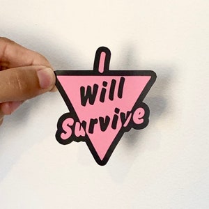 May include: Pink triangle sticker with black outline and the text "I will survive" in black.