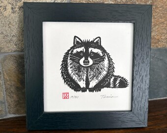 Round raccoon in a square frame. Original signed linocut art.