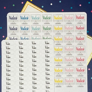 May include: Sticker sheets with the word "Video" in different colours and fonts. One sheet has the word "Video" repeated vertically. Another sheet has "Video" inside a retro computer monitor graphic.