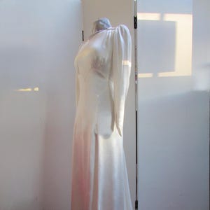 A very sweet 1930s white satin wedding gown, charming dress small fitting with long sleeves pretty shoulder detail & circular puddle train S