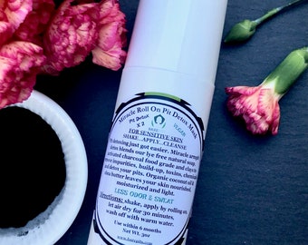 May include: White roll-on deodorant bottle with a green and black label that says "Miracle Roll On Pit Detox Mask". The label also says "For Sensitive Skin" and "Shake...Apply...Cleanse".