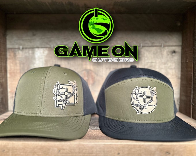 Big Ocho- Game On bull elk hat in army green and black. Available in a   panel Flat Bill or trucker (snap back hat)