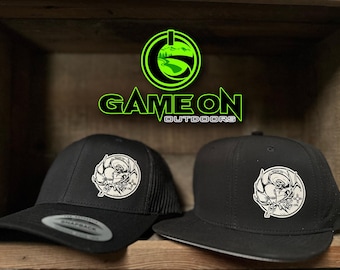 Day of the dead-  Game On bull elk hunter design.  Available in a 6 panel Flat Bill or trucker (snap back hat)