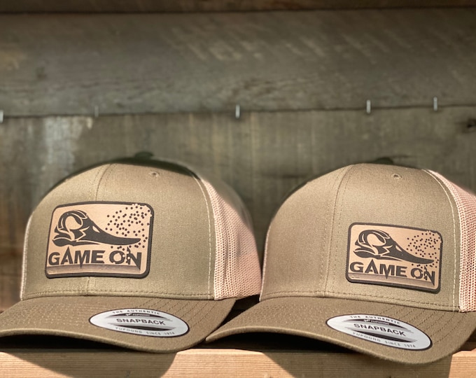 Waterfowl GAME ON! The green head cap is available in two different sizes of patches. A SnapBack trucker hat. One size fits most