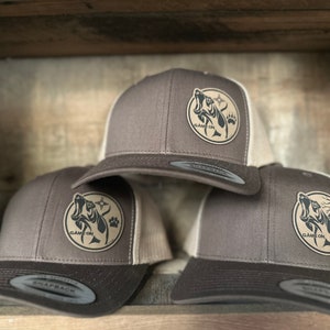 Game On hound dog hat. Snap back hat in brown available in 3 designs. With or without the zia message for  more color options.