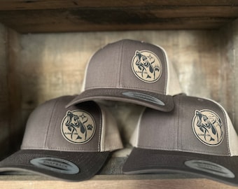 Game On hound dog hat. Snap back hat in brown available in 3 designs. With or without the zia message for  more color options.