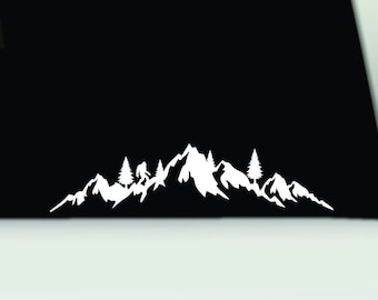 May include: White silhouette of a mountain range with a single figure walking on a path. The mountains are outlined with a jagged edge and there are three trees in the foreground.