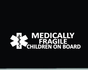 May include: White sticker with the text "MEDICALLY FRAGILE CHILDREN ON BOARD" and a medical symbol. The sticker is on a black background.