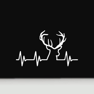May include: A white graphic decal featuring a continuous line drawing of a deer head with antlers integrated into a heartbeat rhythm line, set against a solid black background. The design combines wildlife imagery with an EKG pulse pattern.