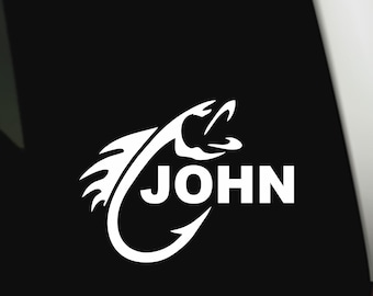 May include: White vinyl decal featuring a stylized fish hook design with the name "JOHN" in bold, capital letters. The design includes a fish head and a curved hook, suitable for fishing enthusiasts.