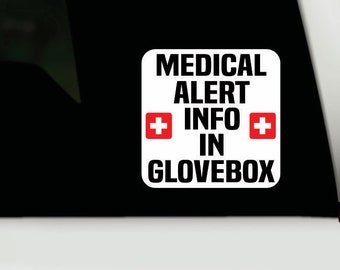 May include: White sticker with black text that reads "MEDICAL ALERT INFO IN GLOVEBOX". The sticker has two red Swiss crosses on either side of the word "INFO".
