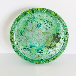 Green glittery butterfly and flower resin coaster