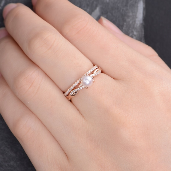 Husar's House of Fine Diamonds. 14Kt White and Rose Gold Infinity Diamond  Engagement Ring