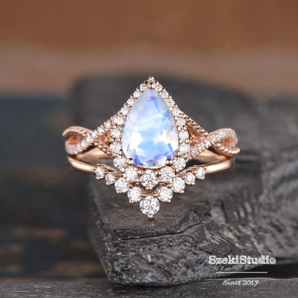 Rose gold pear moissanite engagement best sale ring