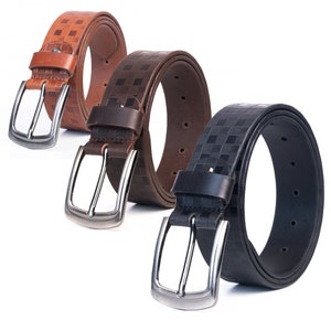 May include: Three leather belts with checkered patterns. The belts are brown, dark brown, and black. Each belt has a silver buckle.