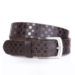 May include: A brown leather belt with a silver buckle. The belt has a checkered pattern.