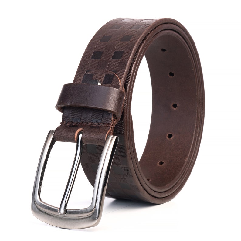May include: A brown leather belt with a checkered pattern and a silver buckle.