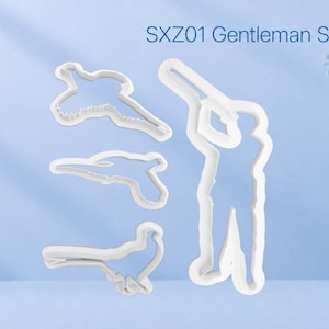 May include: A set of four white plastic cookie cutters labelled SXZ01 Gentleman Shooter Set. The shapes include a person holding a shotgun, a flying bird, a handgun, and a bird perched on a branch, all featuring clean, defined outlines.