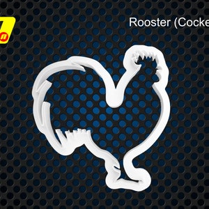 May include: A white plastic cookie cutter shaped like a rooster, also known as a cockerel. The design features the distinct silhouette of the bird with a prominent comb and tail feathers. A yellow logo with the letter n is visible in the corner.