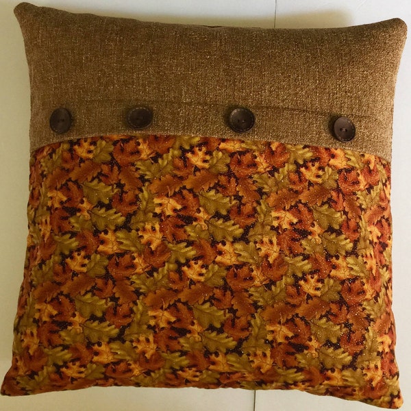 Two-tone pillow cover, half tan/brown with orange, green and brown leaves 4 brown buttons on fold, full tan back, upholstery fabric 20x20