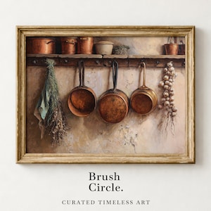 May include: A framed print depicting a rustic kitchen. Copper pots and pans hang from a wooden rack, with bundles of herbs and garlic. The artwork uses warm, earthy tones and includes the text "Brush Circle. Curated Timeless Art."