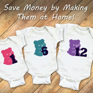 May include: Three white baby onesies with a bear design and a number. The bears are pink, teal, and purple. The numbers are black and the onesies are on a wooden surface. Save Money by Making Them at Home!